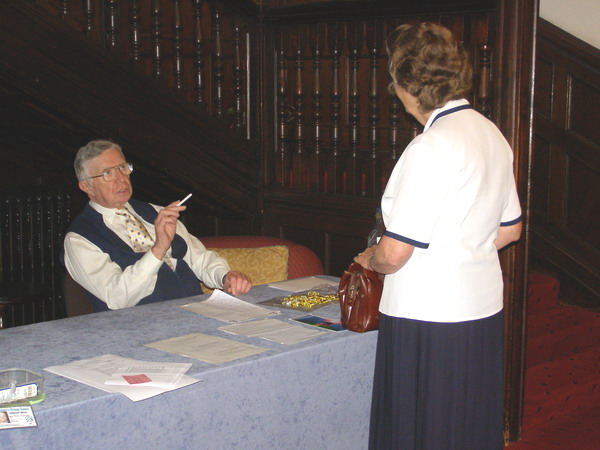 Don Galloway seated at the desk in the entrance hall of Cober Hill.