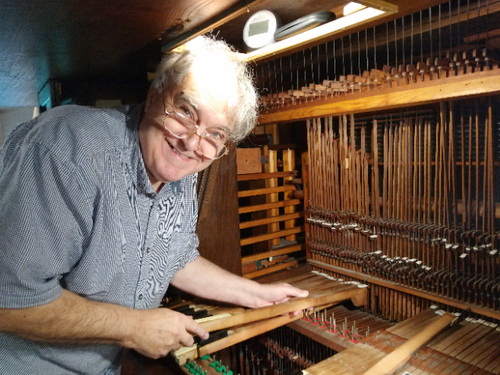 John Hardaker assisting in some work on the organ in St Lawrence, North Hinksey.