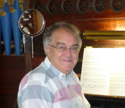 John Hardaker at the console of the organ in St Denys', Northmoor.
